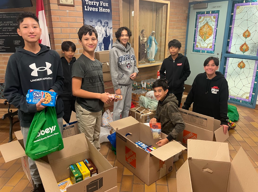 Picture of people doing a food drive