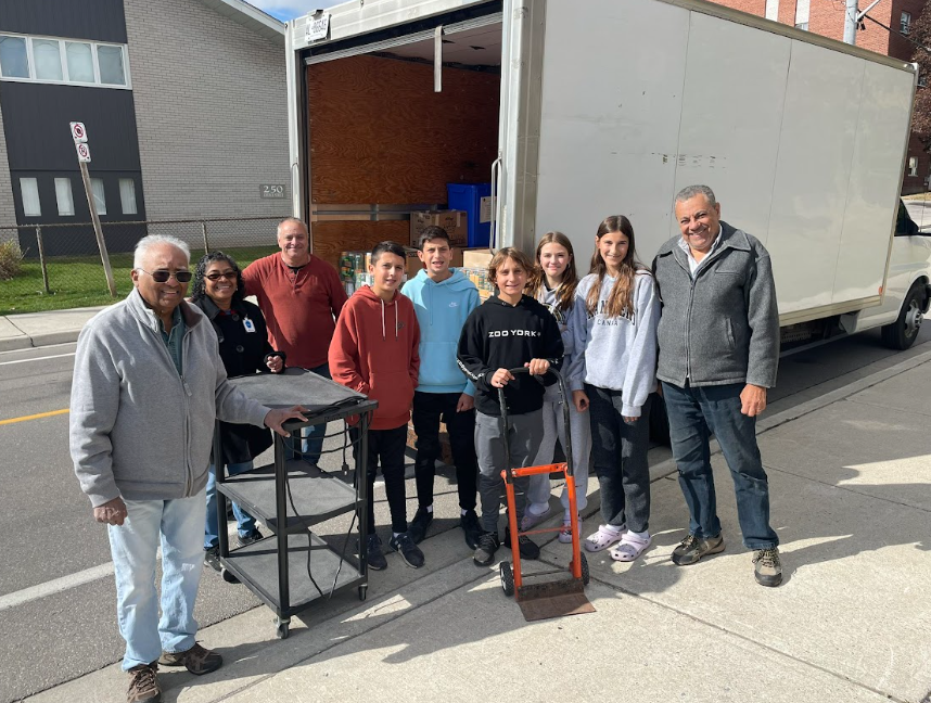 Picture of people in front of a moving truck